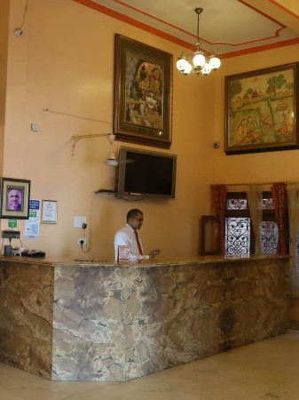 Welcoming reception area at Rashmi Guest House, Varanasi, with traditional decor and modern amenities